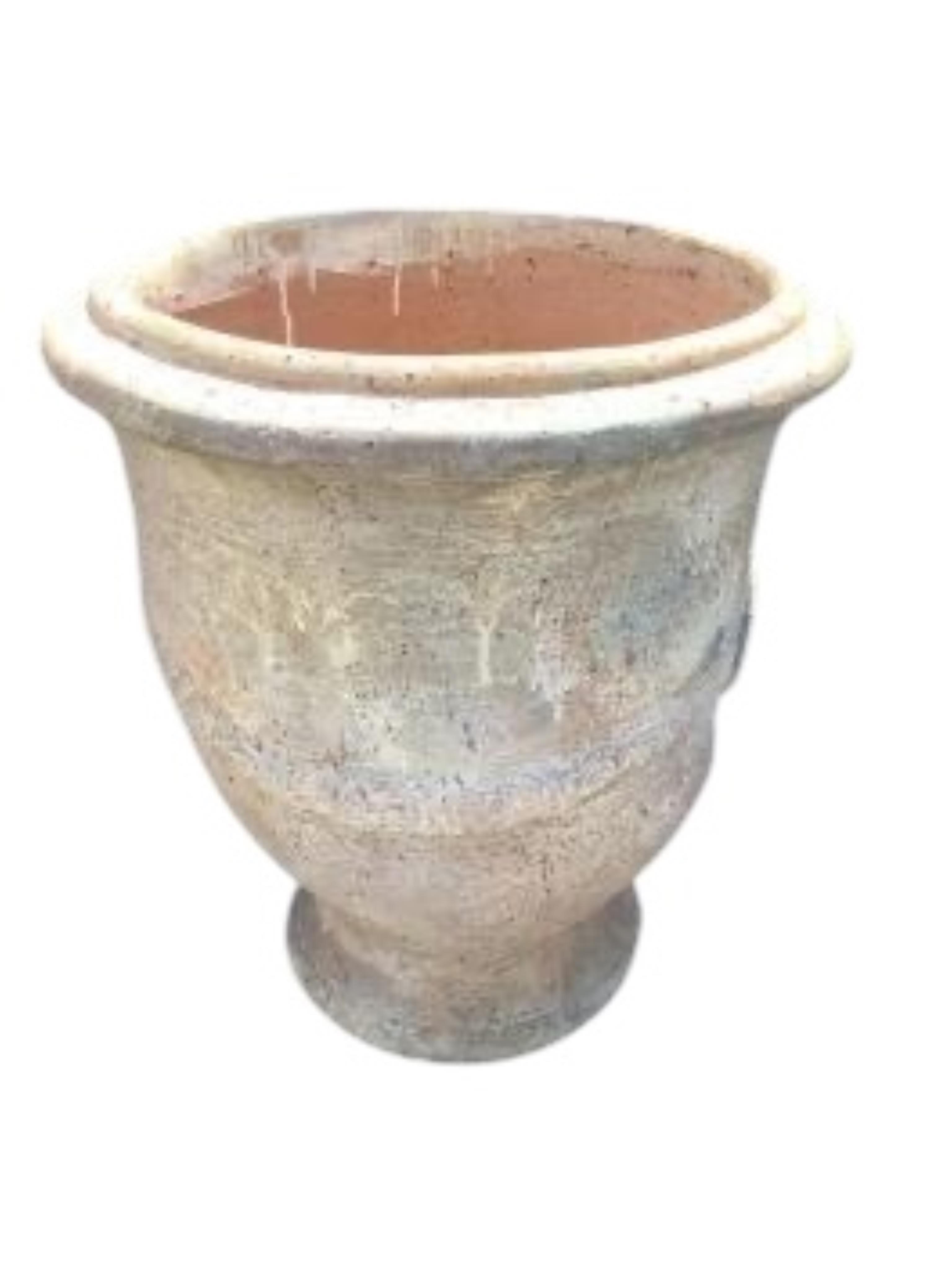 A pair of large circular earthenware garden planters, diameter 61cm, height 68cm